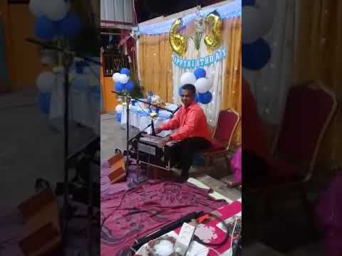 Jairam Dindial singing at a 63rd Birthday party