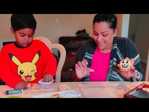 Pikachu Pandu decorating Cookies with Mommy for Halloween